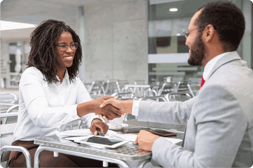 woman shaking hands with man